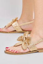 GOLD BOW DETAIL FLAT SANDALS